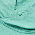 Close-up of the adjustable snap buttons and soft fabric texture in a blue-green shade on the Performance Sun Hoodie, highlighting its lightweight and breathable material.