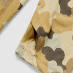 Close-up detail of tan and brown camouflage fabric with reinforced stitching on the sleeve of the Performance Sun Hoodie.