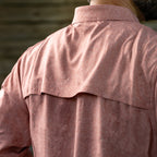 Close-up rear view of a man wearing a textured, faded red F'n Soft Daily Shirt showing the breathable vented yoke detail and soft fabric texture.
