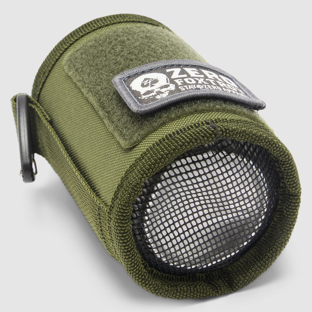 Rations Drink Wrap in olive green fabric with a black mesh end adjustable side strap and stitched patch shown rolled into a cylindrical drink holder