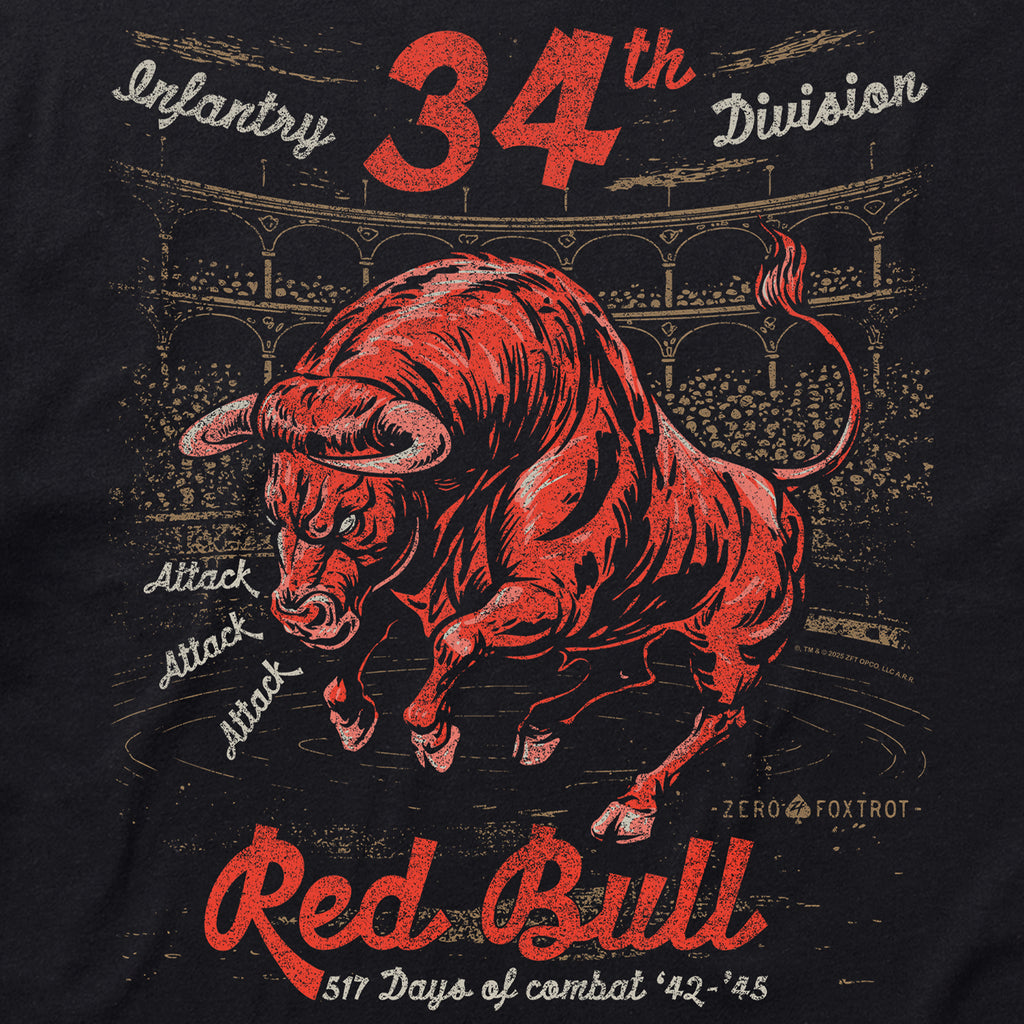 Close-up of a bold graphic on the Red Bull Attack Tee featuring a red charging bull, vintage text reading "34th Infantry Division" and "517 Days of Combat '42-'45" with an aged stadium background.