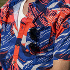 Surf Shirts (Last Chance) patterned short sleeve shirt in red, blue, and white with a button front, chest pocket, and sunglasses tucked into the pocket