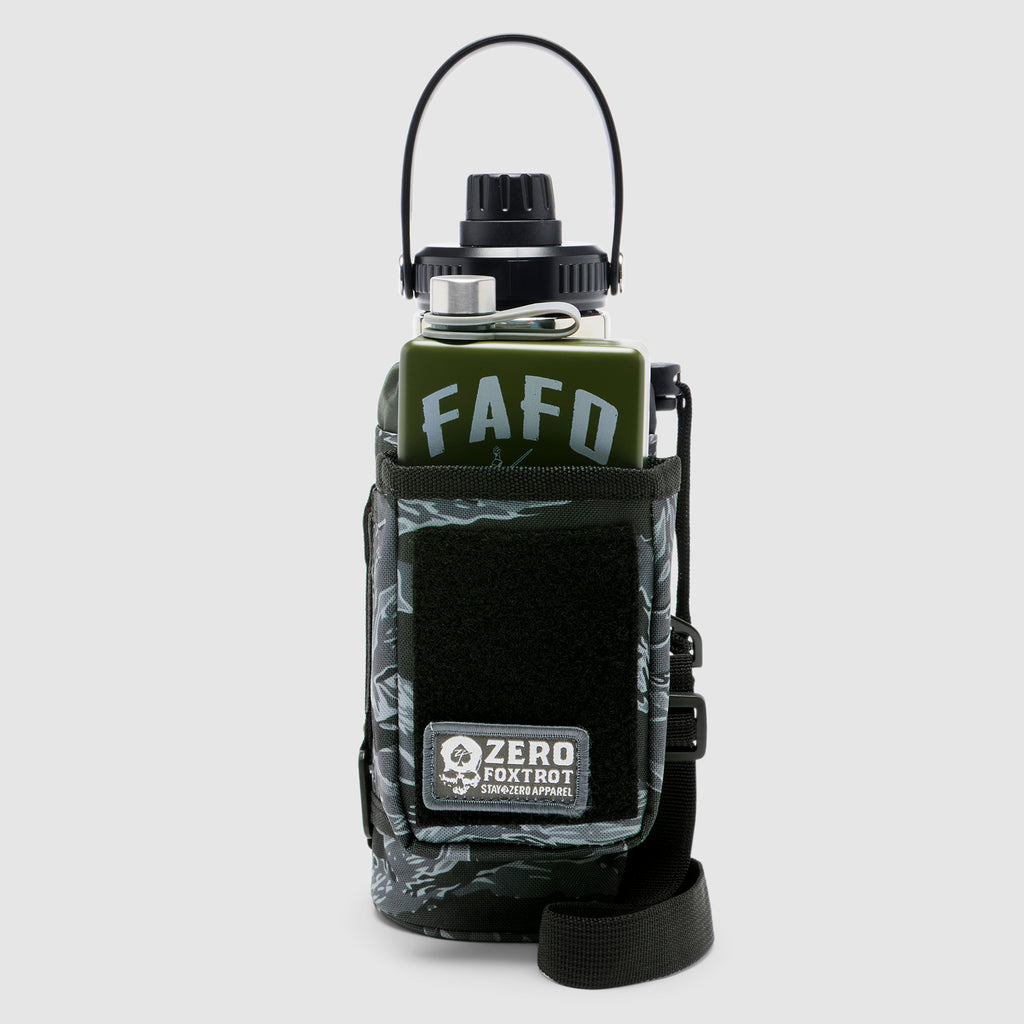 TAC Ruck Bottle - 32oz in green with black tiger stripe patterned protective sleeve featuring a front pocket and adjustable strap, designed for tactical and outdoor use.