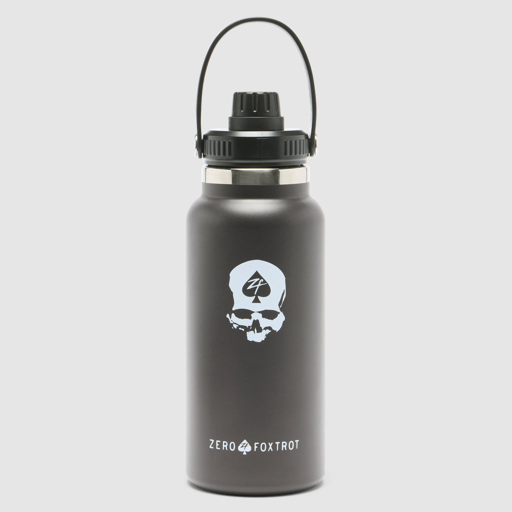 TAC Ruck Bottle - 32oz in matte black featuring a skull logo with 4-digit emblem, durable metal construction, and a secure screw-on lid with a carry handle.