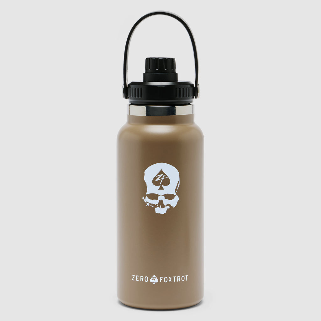 TAC Ruck Bottle - 32oz in coyote brown with a black screw-on lid and carrying handle, featuring a white skull logo and Zero Foxtrot branding on the front.