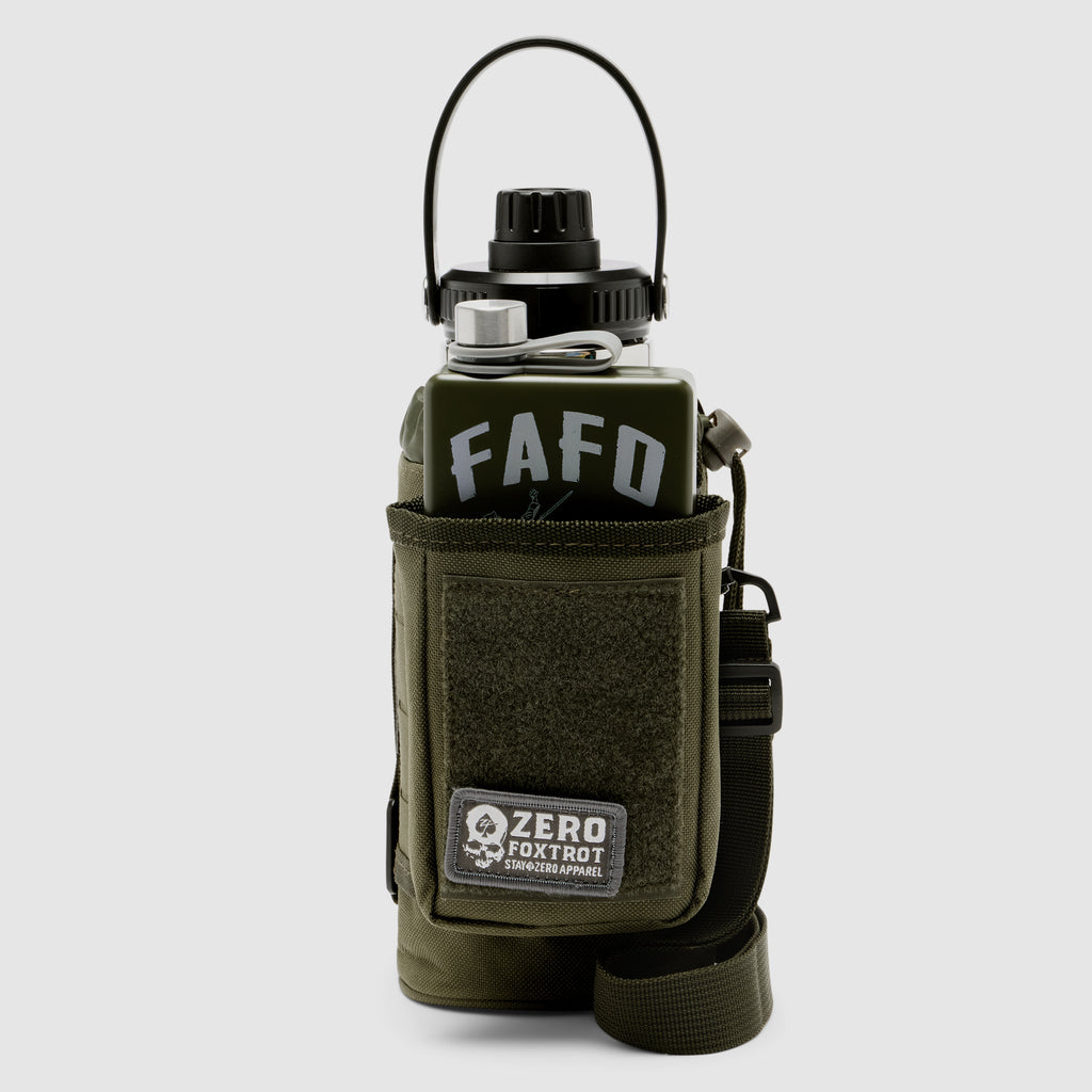 Portable tactical water bottle in dark olive color featuring a sturdy cap and carrying handle, housed in a durable fabric sleeve with adjustable straps, labeled TAC Ruck Bottle - 32oz.