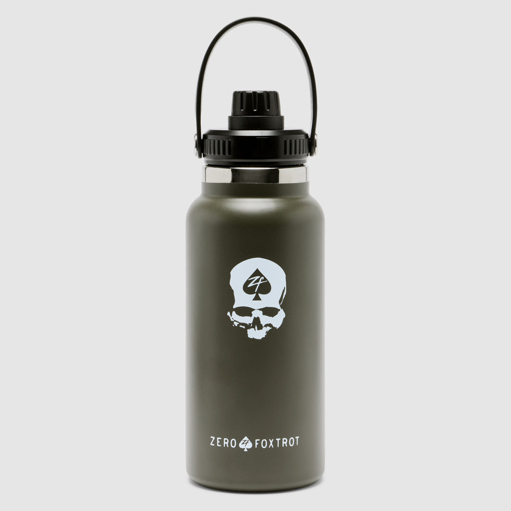 TAC Ruck Bottle - 32oz in dark olive green with a black handle and screw-on lid, featuring a white skull logo with the Zero Foxtrot emblem on the front.