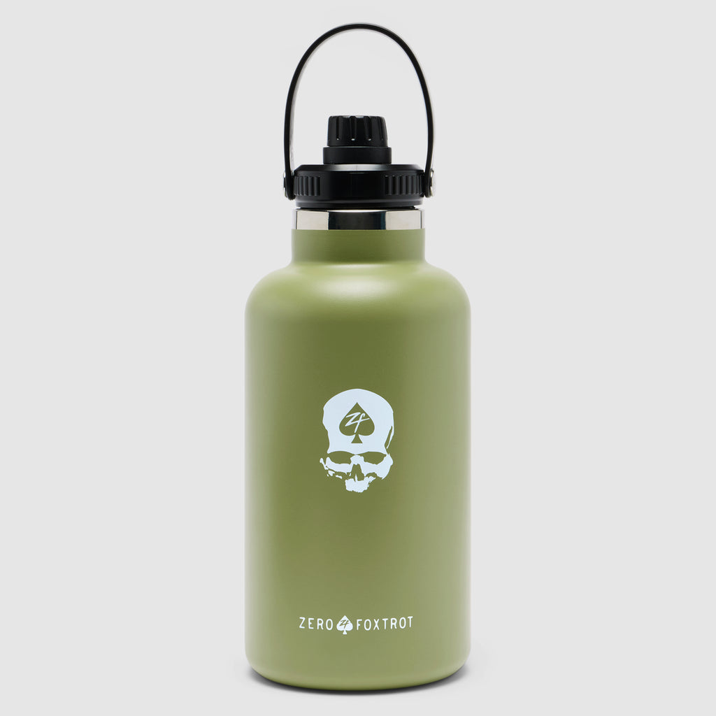 TAC Ruck Bottle - 64oz in olive green with a black loop handle and cap, featuring a white skull emblem on the front