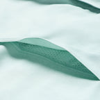 Close-up of aqua fabric showcasing the soft texture and breathable perforated lining of the Short Sleeve F'n Soft Shirt.