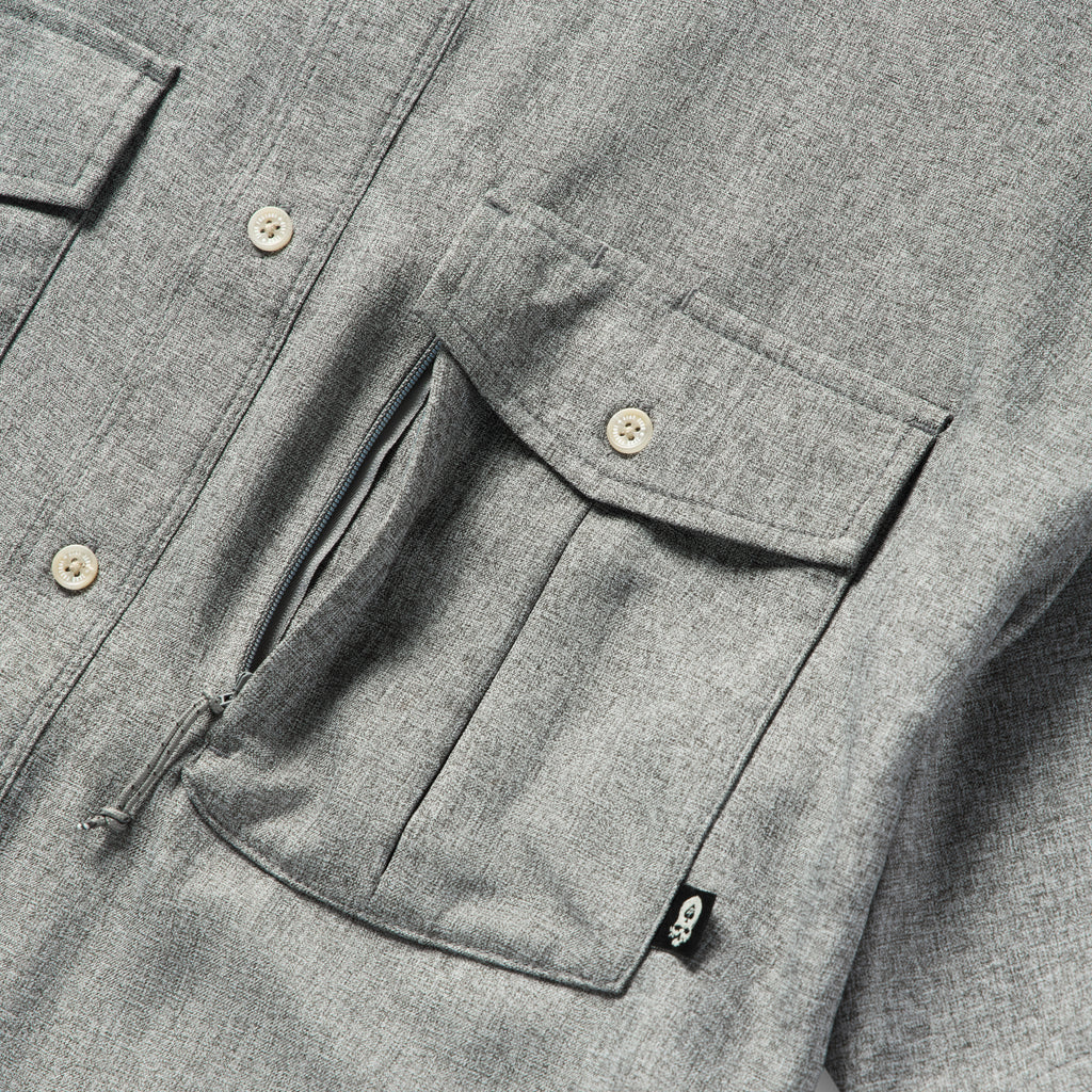 Close-up of the chest area of the Short Sleeve F'n Soft Shirt in charcoal, highlighting the buttoned flap pockets and soft textured fabric.