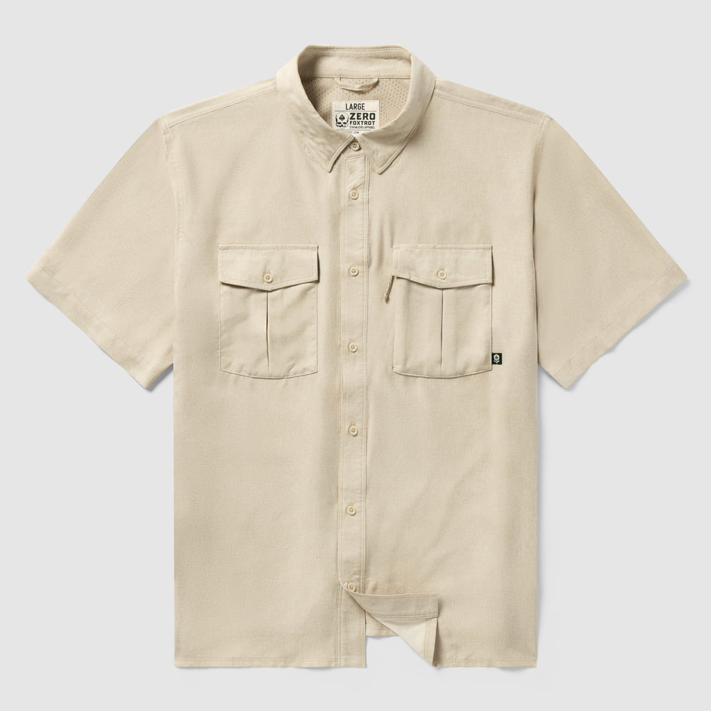 Short Sleeve F’n Soft Shirt in tan color, featuring a soft fabric, short sleeves, button-down front, and two chest pockets with button closures.