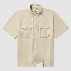 Short Sleeve F’n Soft Shirt in tan color, featuring a soft fabric, short sleeves, button-down front, and two chest pockets with button closures.