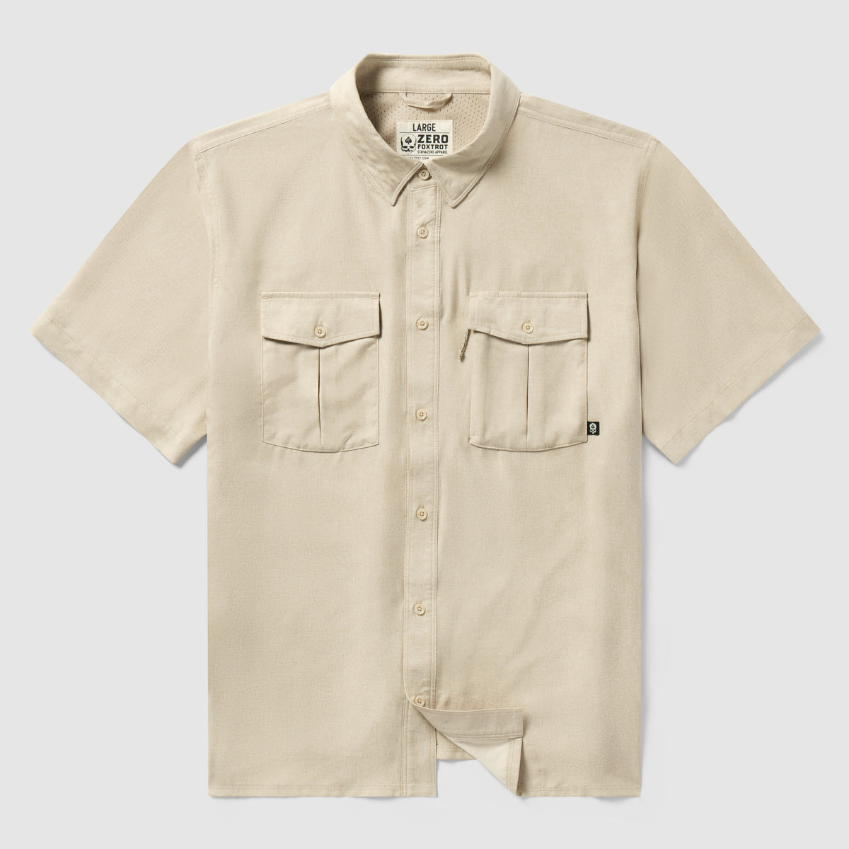 Short Sleeve F’n Soft Shirt in tan color, featuring a soft fabric, short sleeves, button-down front, and two chest pockets with button closures.