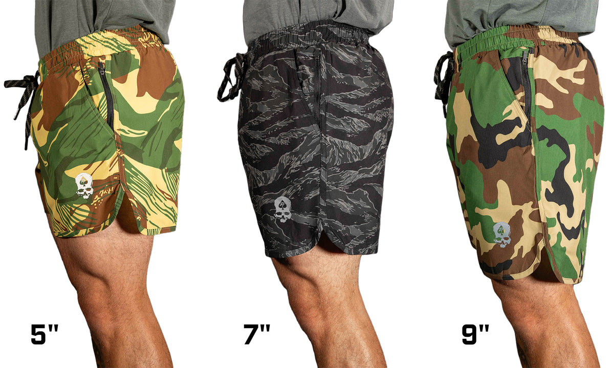 Side view of three camo-patterned shorts in different inseam lengths, featuring skull logo and drawstring waist, highlighting the "Zero Shorts - 7" Inseam" variant in the center.