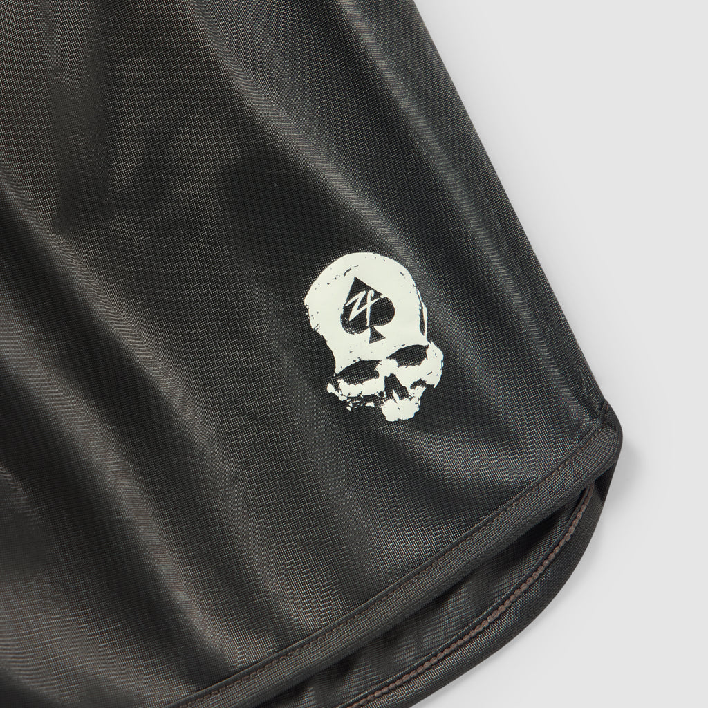ZF Silkies - Solids black silky fabric closeup featuring a white skull graphic and neatly stitched hem edge
