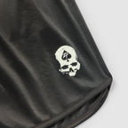 ZF Silkies - Solids black silky fabric closeup featuring a white skull graphic and neatly stitched hem edge