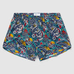 Liberty Skull Silkies boxer shorts featuring a colorful skull and floral tattoo-inspired pattern with stars, hearts, and banner motifs on a vibrant blue background.