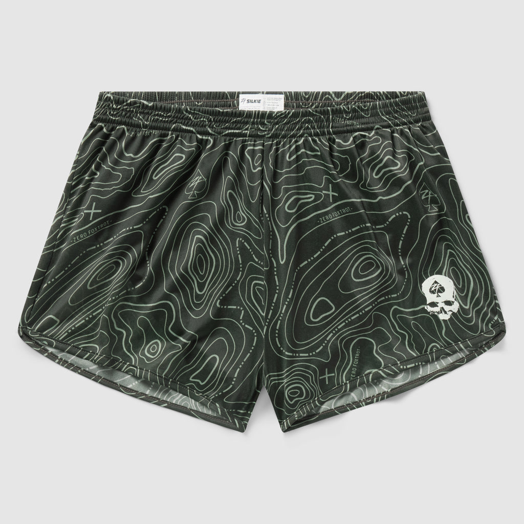 Topographic Silkies in dark green featuring a contour map pattern with a small white skull emblem on the front leg and an elastic waistband for comfort.