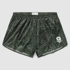 Topographic Silkies in dark green featuring a contour map pattern with a small white skull emblem on the front leg and an elastic waistband for comfort.