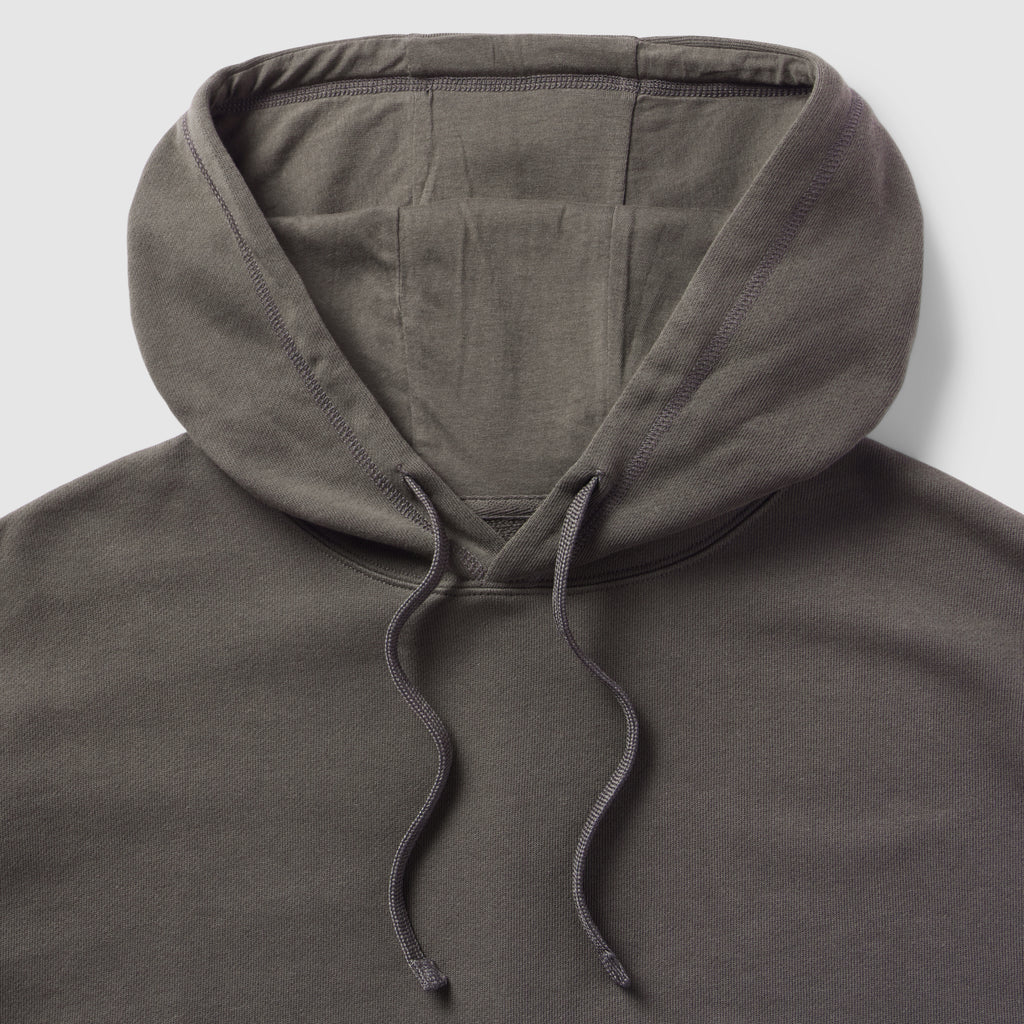 Close-up view of a dark gray hood with drawstrings on a Smuggler French Terry Muscle Hoodie, showcasing the soft fabric and sturdy stitching.