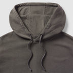 Close-up view of a dark gray hood with drawstrings on a Smuggler French Terry Muscle Hoodie, showcasing the soft fabric and sturdy stitching.