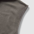 Close-up view of the soft fabric texture and stitching detail on the shoulder of the Smuggler French Terry Muscle Hoodie in a muted gray color.