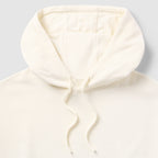 Close-up of the cream-colored hood and drawstrings of the Smuggler French Terry Muscle Hoodie made from soft, lightweight fabric.