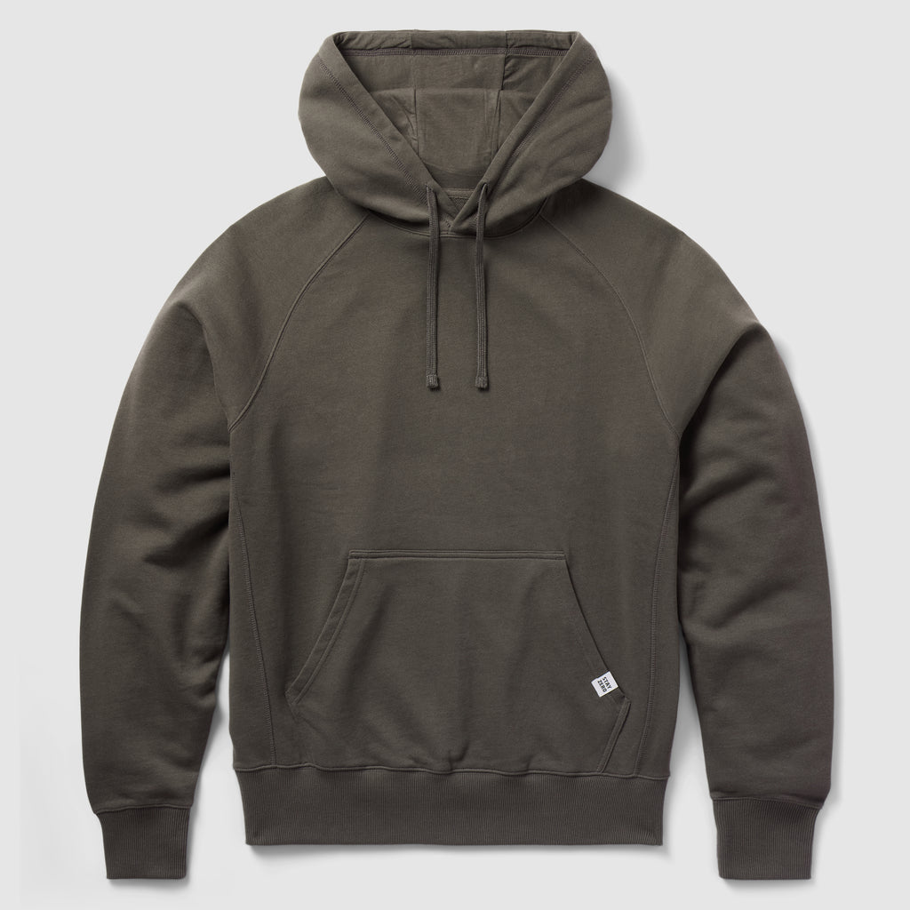 Smuggler French Terry Hoodie in dark gray with a front kangaroo pocket, drawstring hood, and ribbed cuffs and hem, made from soft and comfortable French terry fabric.