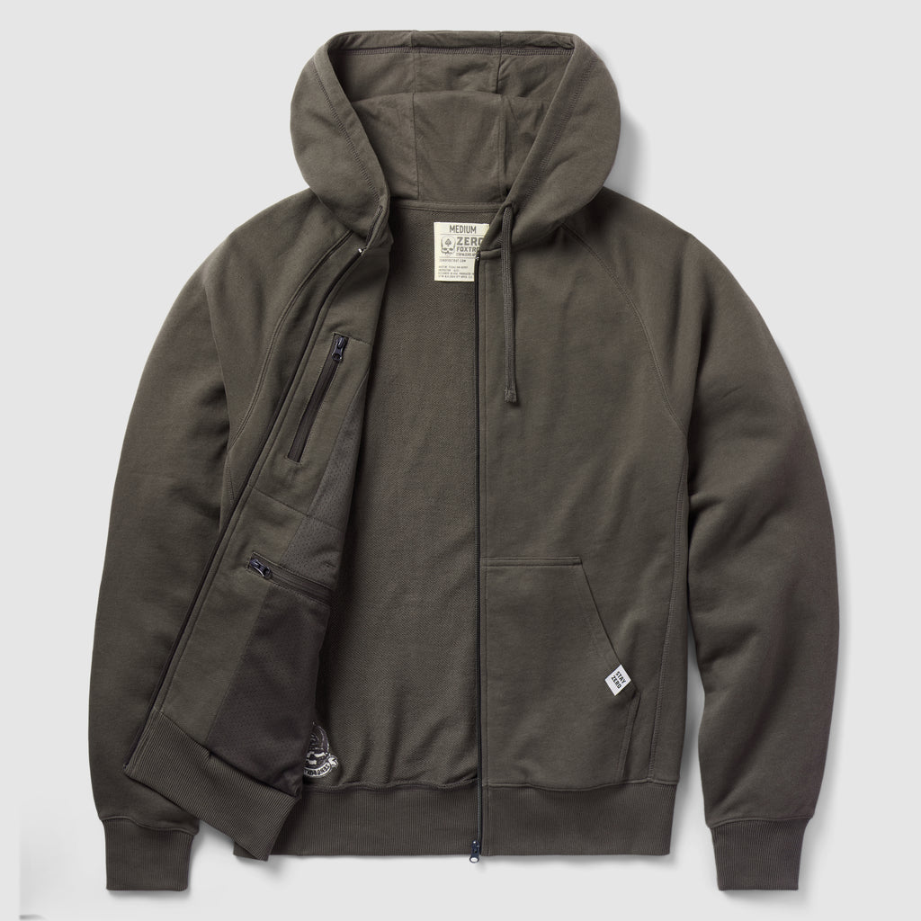 Smuggler French Terry Zip Hoodie in dark gray, featuring a full front zipper, attached hood with drawstrings, ribbed cuffs and hem, and front pockets with one zippered inner pocket.
