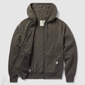 Smuggler French Terry Zip Hoodie in dark gray, featuring a full front zipper, attached hood with drawstrings, ribbed cuffs and hem, and front pockets with one zippered inner pocket.