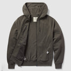 Smuggler French Terry Zip Hoodie in dark gray, featuring a full front zipper, attached hood with drawstrings, ribbed cuffs and hem, and front pockets with one zippered inner pocket.