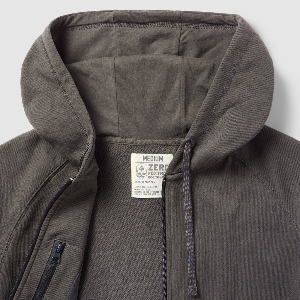 Smuggler French Terry Zip Hoodie in dark gray with a close-up of the unzipped front, hood, and interior label showing medium size and fabric details.