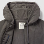 Smuggler French Terry Zip Hoodie in dark gray with a close-up of the unzipped front, hood, and interior label showing medium size and fabric details.