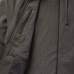 Close-up view of the interior and exterior details of the Smuggler French Terry Zip Hoodie, highlighting the zippered pockets and textured fabric in a dark, muted tone.