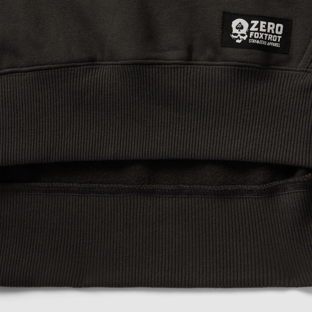 Smuggler Fleece Crew black fleece outerwear close up showing ribbed hem detailing soft interior lining and a branded label