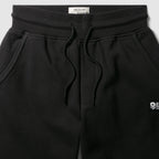 Smuggler Fleece Jogger in black with elastic waistband, adjustable drawstring, side pockets, and a small logo detail on the upper leg.