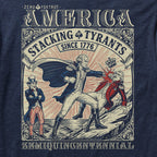 Close-up of a navy blue Stacking Tyrants Tee featuring a vintage-style graphic of a historical figure punching a crowned tyrant with Uncle Sam watching, surrounded by ornate framing and text.