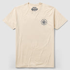 Stacking Tyrants Tee - Cream, cream short sleeve graphic T-shirt laid flat with a small circular emblem printed on the left chest.