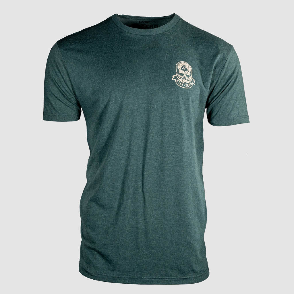 Front view of a dark green short-sleeve crewneck t-shirt featuring a small skull and crossbones graphic with "Strike Hard" text on the upper left chest, labeled Strike Hard Tee.