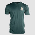Front view of a dark green short-sleeve crewneck t-shirt featuring a small skull and crossbones graphic with "Strike Hard" text on the upper left chest, labeled Strike Hard Tee.