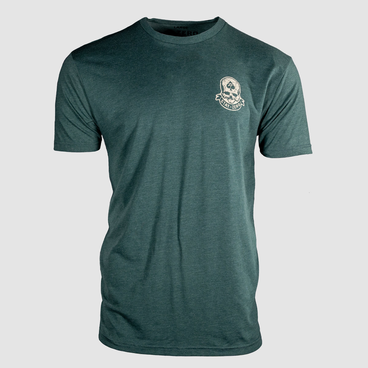 Front view of a dark green short-sleeve crewneck t-shirt featuring a small skull and crossbones graphic with "Strike Hard" text on the upper left chest, labeled Strike Hard Tee.