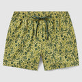 Swim Trunks featuring a green camouflage pattern with silhouettes of toy soldiers, an elastic waistband, and adjustable drawstring for a comfortable fit.