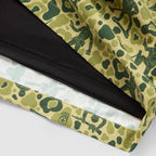 Close-up of Swim Trunks featuring a green camouflage pattern with army men silhouettes and an inner black mesh lining for comfort and durability.