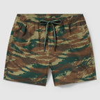 Swim Trunks featuring a green and brown camouflage pattern with an adjustable drawstring waistband, designed for comfortable and stylish wear at the beach or pool.