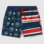 Swim Trunks featuring a patriotic design with navy blue, red, and white stripes, stars, and eagle emblems, secured with a red drawstring waistband.