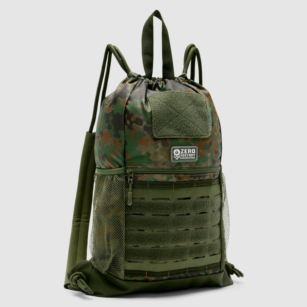 TAC Drawstring Pack in camouflage pattern featuring a drawstring closure, mesh side pockets, a front zippered compartment, and a top handle for easy carrying.