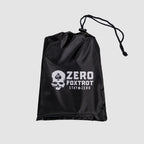 Black mesh drawstring bag with white skull and spade logo and "Zero Foxtrot Stay Zero" text, designed to hold the Microfiber Beach Towel (2025).