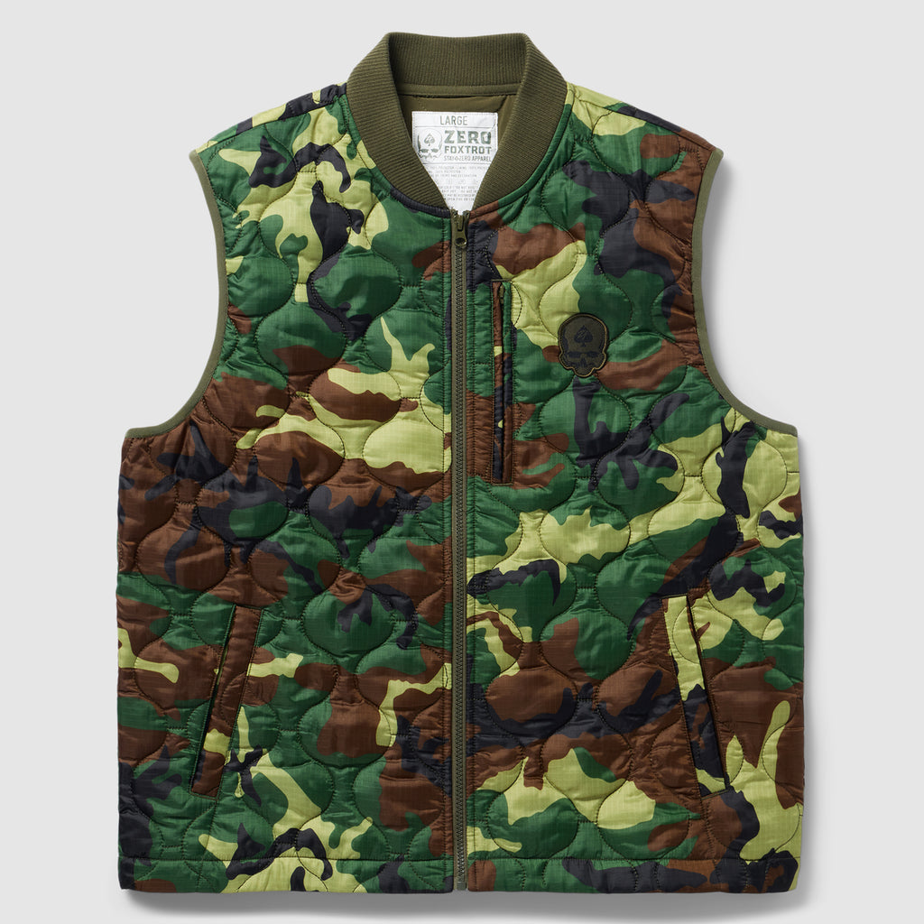 Woobie Vest (Last Chance), quilted camouflage vest with olive ribbed collar, full front zipper, and zippered lower pockets on a light background