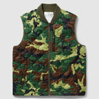 Woobie Vest (Last Chance), quilted camouflage vest with olive ribbed collar, full front zipper, and zippered lower pockets on a light background
