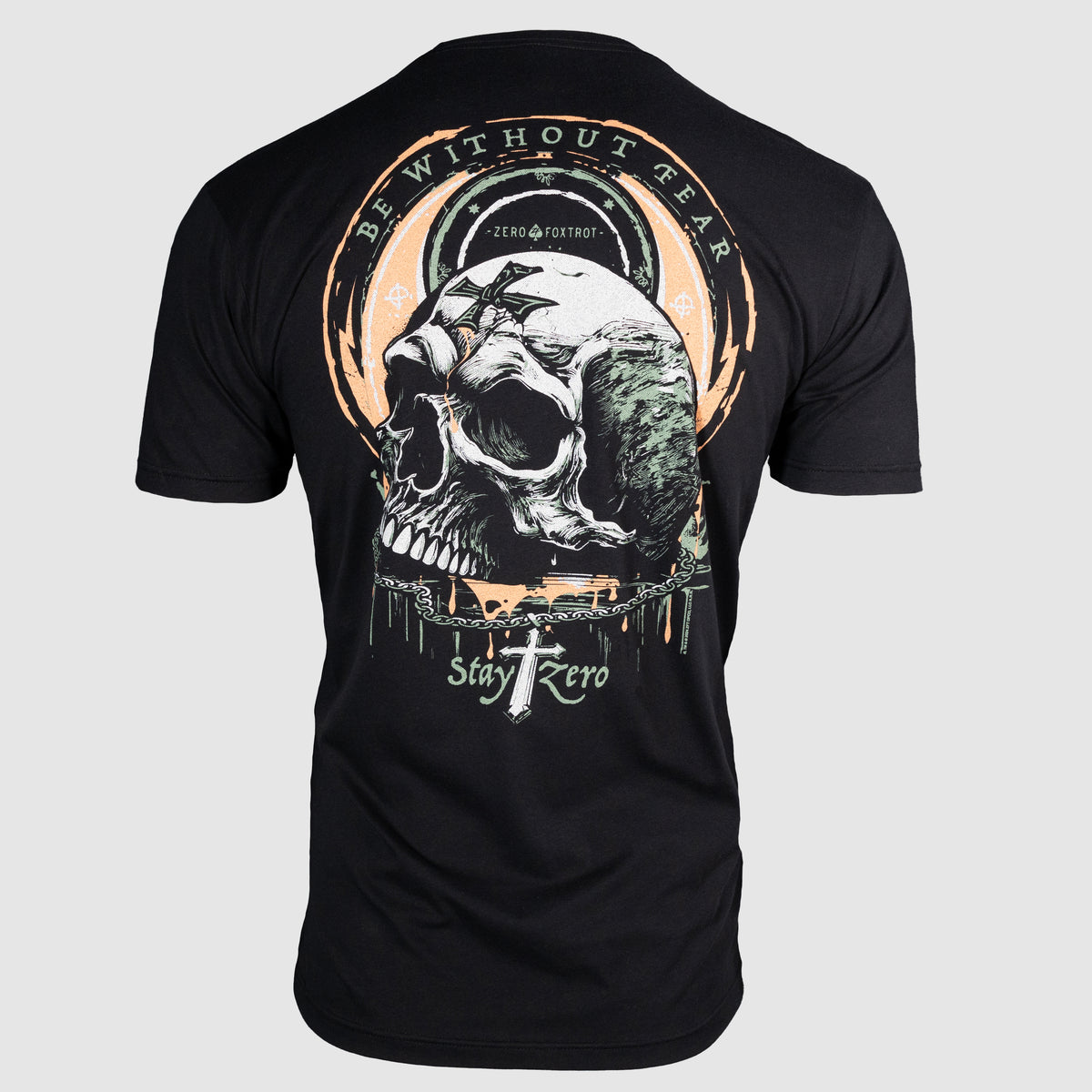 Back view of a black Without Fear Tee featuring a detailed skull graphic with bats, circular text "Be Without Fear," and the phrase "Stay Zero" with a cross design.